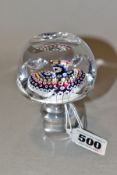 A WHITEFRIARS PENTAGON SHAPED CLEAR GLASS AND MILLEFIORE DECANTER STOPPER, bears indistinctly