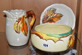 THREE PIECES OF CLARICE CLIFF POTTERY MOULDED IN THE AUTUMN LEAVES PATTERN, comprising a Newport