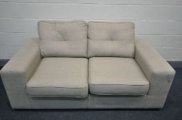 A BEIGE UPHOLSTERED TWO SEATER SOFA BED, length 178cm