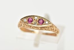 A 9CT GOLD RUBY AND DIAMOND BOAT RING, a navette shaped ring set with two circular cut ruby