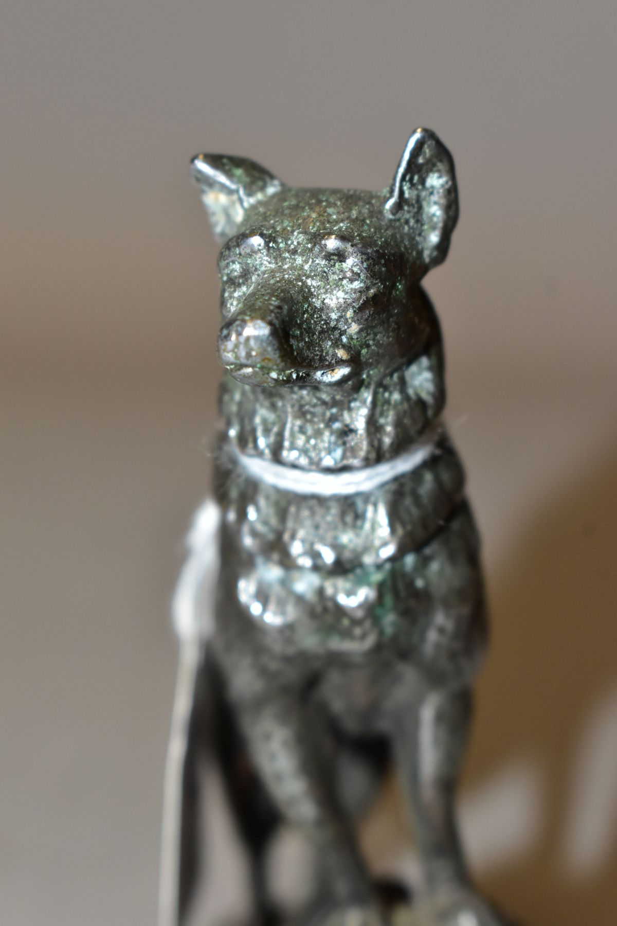 A CHROMED METAL CAR MASCOT IN THE FORM OF AN ALSATIAN STANDING WITH ITS FRONT LEGS ON A ROCK, - Image 6 of 6