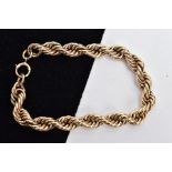 A 9CT GOLD ROPE CHAIN BRACELET, a heavy rope chain, approximate width 8mm, fitted with a spring