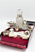 A SET OF SILVER NAPKIN RINGS AND SILVER CONDIMENTS ITEMS, four silver hammered finished napkin rings