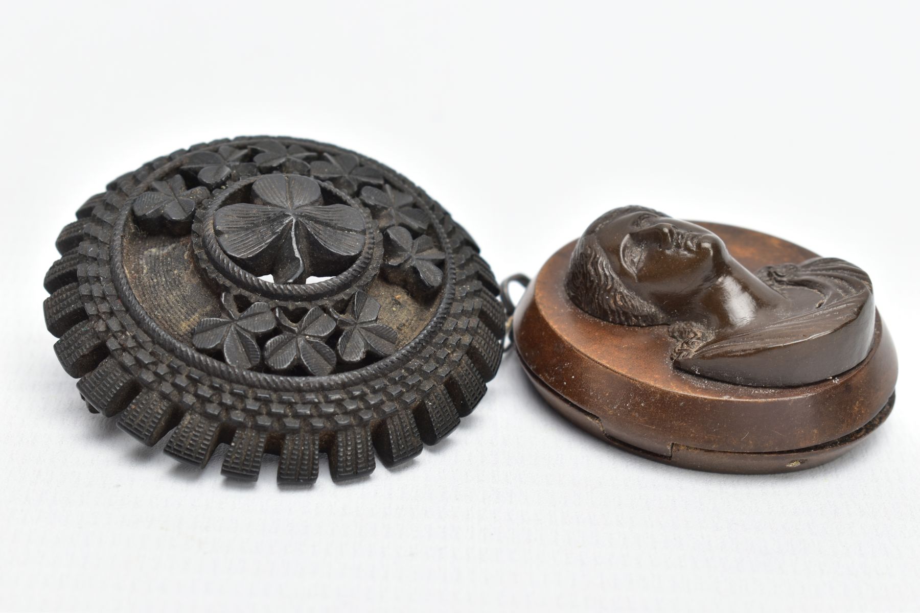 A JET BROOCH AND A VULCANITE PENDANT, the jet brooch of a circular form, decorated with carved - Image 2 of 6