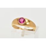AN 18CT GOLD RUBY RING, a circular cut ruby, bezel set, domed tapered band, approximate width 6mm to