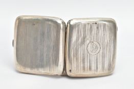 A SILVER CIGARETTE CASE, of a rounded square form, engine turned design with engraved monogram,