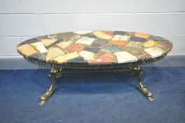 A CONTEMPORY DESIGN RESIN TOP OVAL COFFEE TABLE, on an Italian style brassed base, length 125cm x