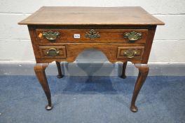 A GEORGIAN OAK LOWBOY, with three drawers, on Queen Anne legs and padded feet, width 76cm x depth