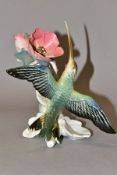 A KARL ENS RUDOLSTADT VOLKSTEDT FIGURE OF A HUMMINGBIRD BESIDE AN OPEN FLOWER, model no.7642,