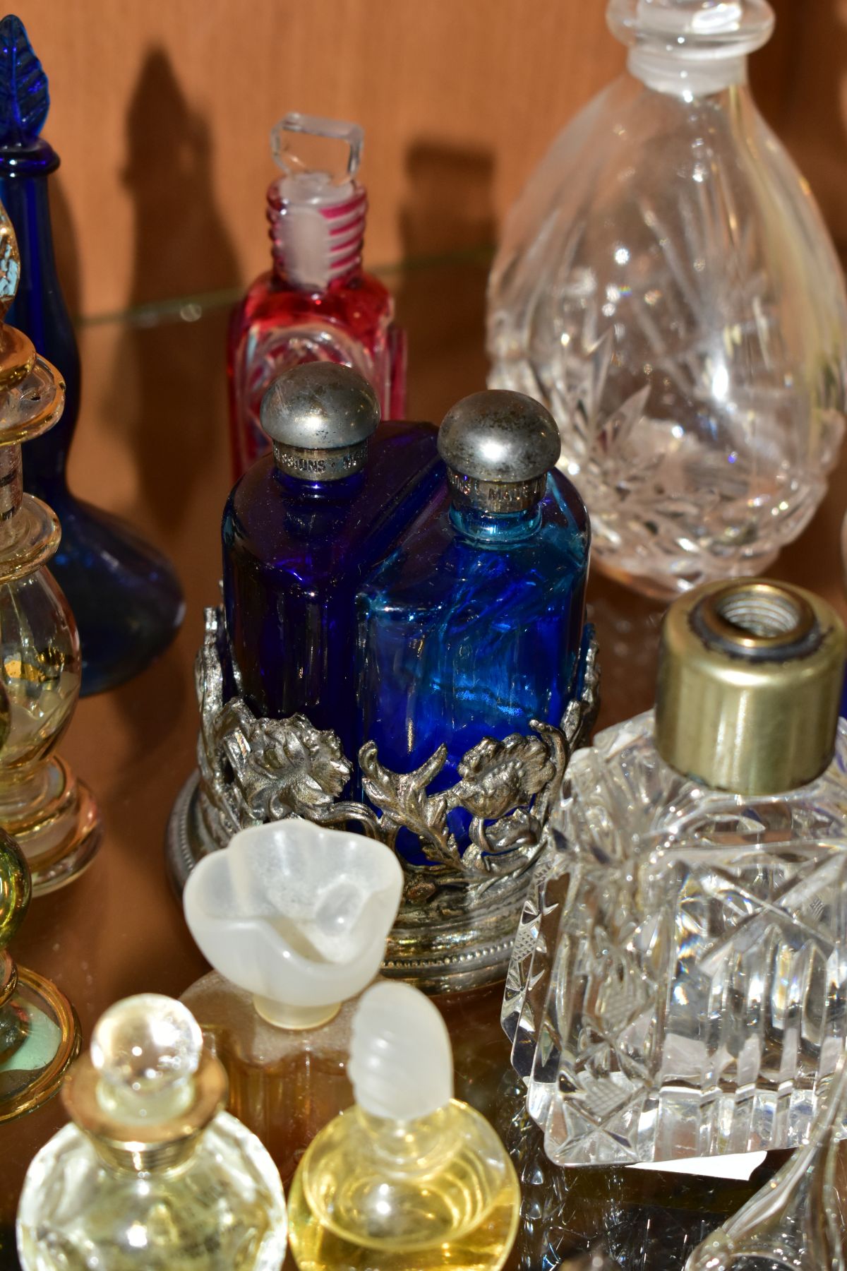 A COLLECTION OF 19TH AND 20TH CENTURY PERFUME BOTTLES , SPARE STOPPERS AND A FUNNEL, mostly glass, - Image 6 of 16