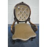 A VICTORIAN ROSEWOOD SPOON BACK ARMCHAIR, with an oval buttoned back, acanthus decoration