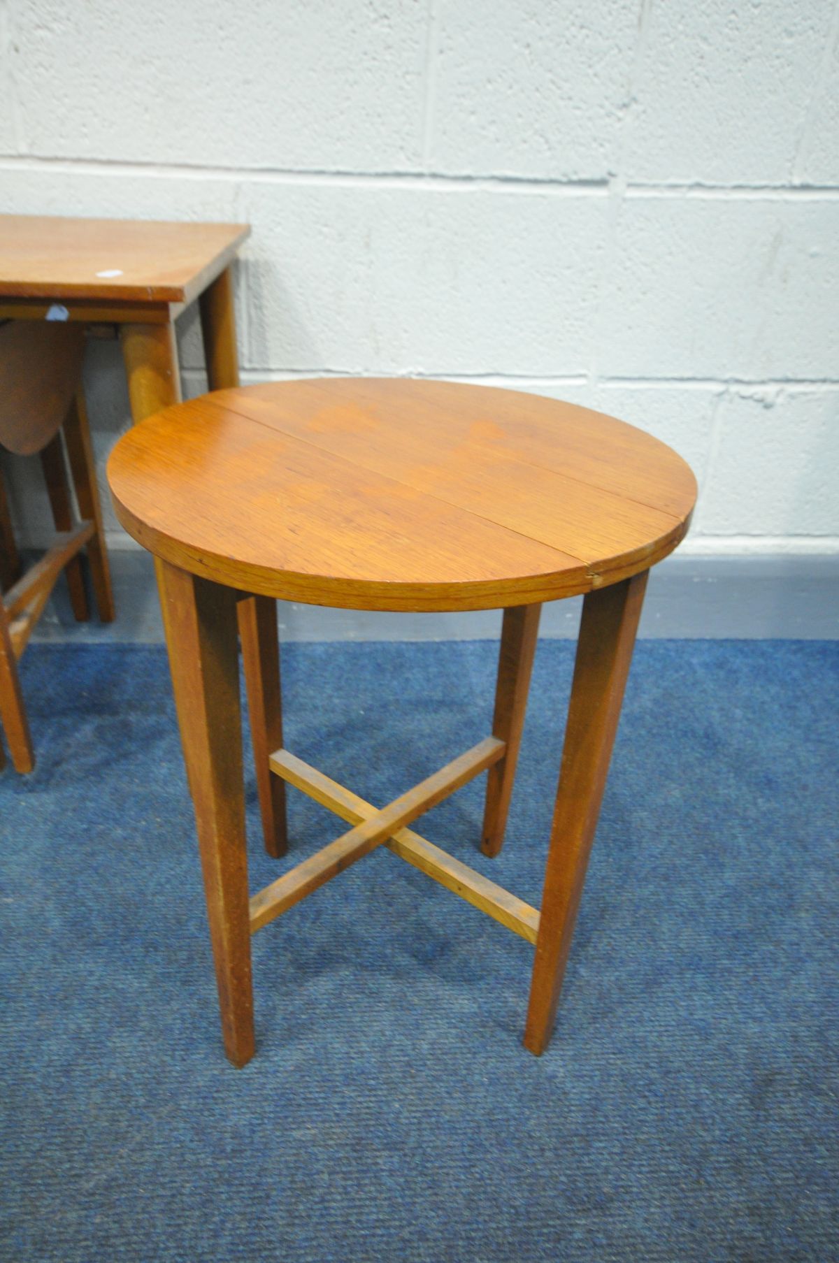 IN THE MANNER OF POUL HUNDEVAD, a mid-century teak nesting tables, with four circular drop leaf - Image 3 of 3