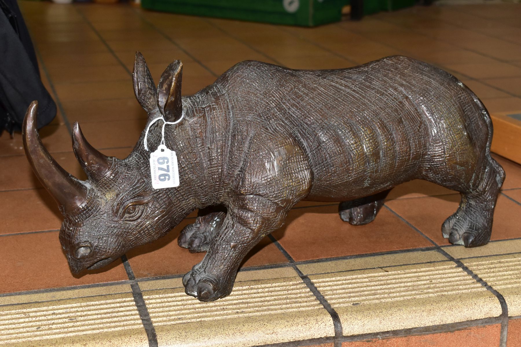 A BRONZE RHINOCEROS FIGURE, height 18cm, length 50cm, heavy (Condition report: good, no obvious