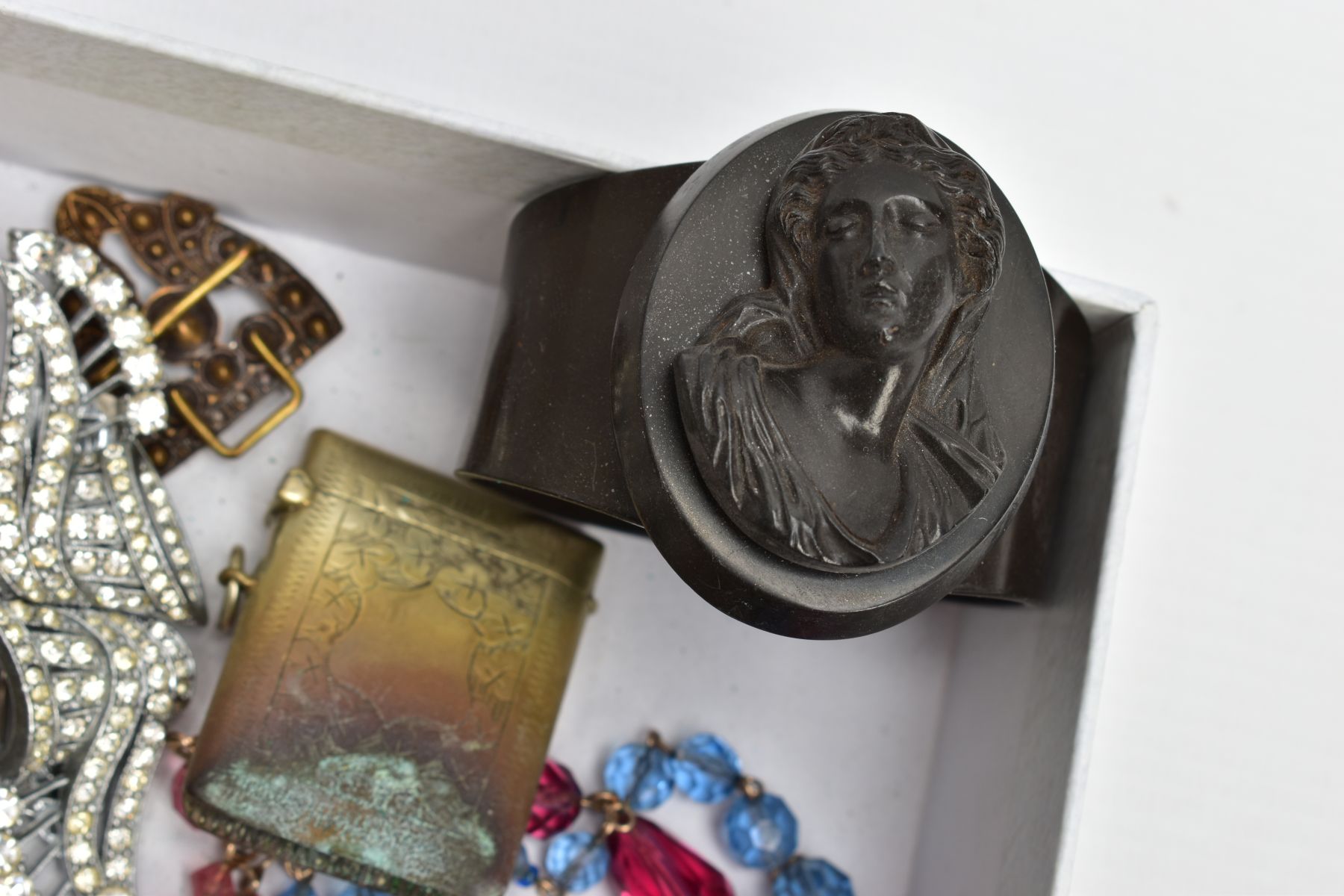 A SELECTION OF COSTUME JEWELLERY, to include a high relief vulcanite cameo bangle, two early to - Image 3 of 6