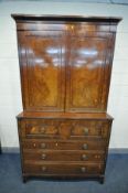 A GEORIGAN MAHOGANY AND WALNUT SECRETAIRE BOOKCASE, the double panelled door top enclosing two