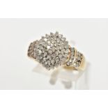 A DIAMOND CLUSTER RING,a yellow metal diamond cluster ring, tapered shoulders to a plain polished