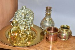 SEVEN PIECES OF ASIAN BRASS WARES, comprising three figures of deities, a brass charger diameter