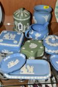 NINE PIECES OF WEDGWOOD JASPERWARE, in pale blue and green, comprising a cream jug, three trinket