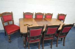 AN EDWARDIAN WALNUT WIND OUT DINING TABLE, with one additional leaf, on turned fluted legs, and