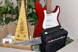 AN ELECTRIC GUITAR, GUITAR STAND, AMPLIFIER AND A PSALTERY comprising an unbranded Strat type guitar