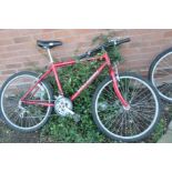 A RALEIGH FIREFLY GENTS MOUNTAIN BIKE with 15 speed Shimano gears and 19in frame