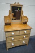 A VICTORIAN PINE DRESSING TABLE, with single swing mirror, and an arrangement of six drawers,