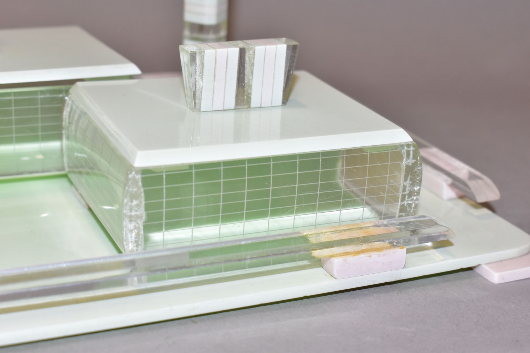 AN ART DECO PINK, GREEN AND CLEAR PLASTIC DRESSING TABLE SET, comprising rectangular tray, a pair of - Image 9 of 12