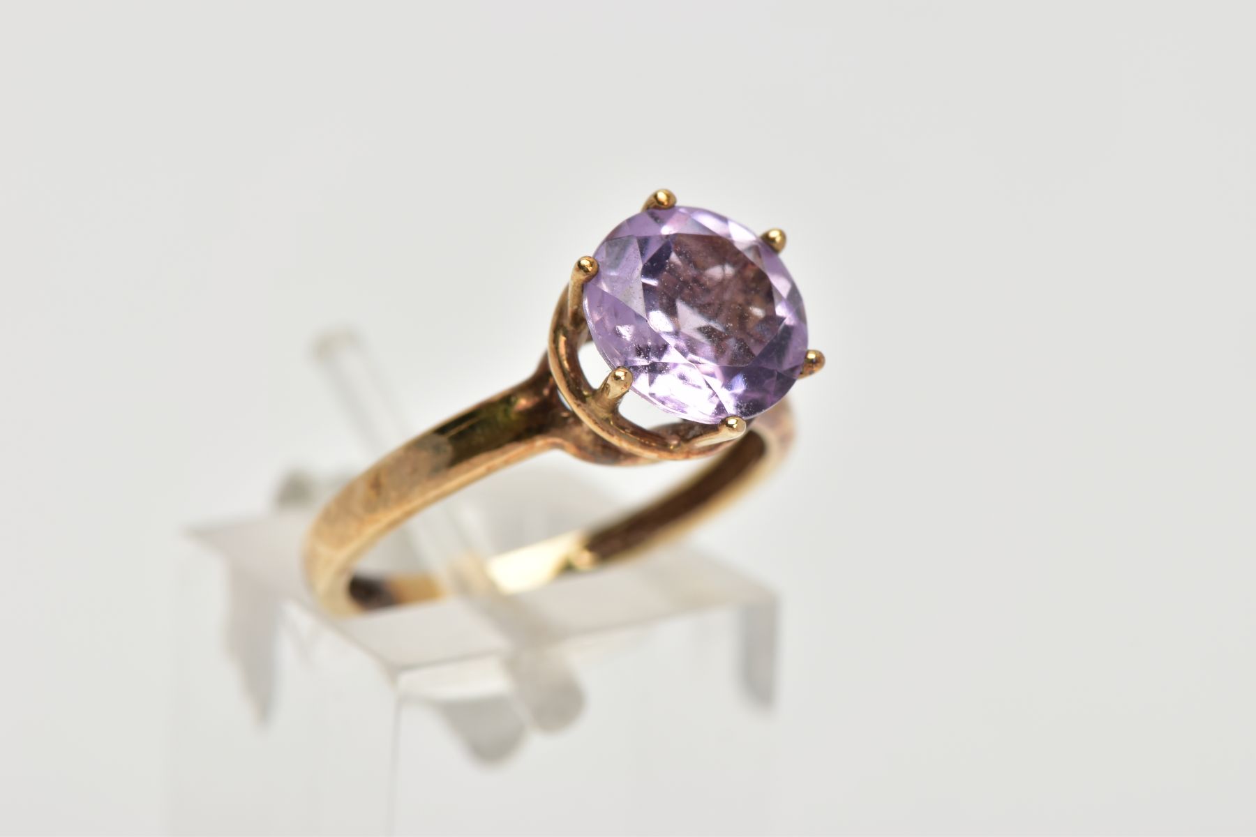 A AMETHYST SOLITAIRE RING, a circular cut amethyst, approximate diameter 9mm, set in a yellow - Image 4 of 4