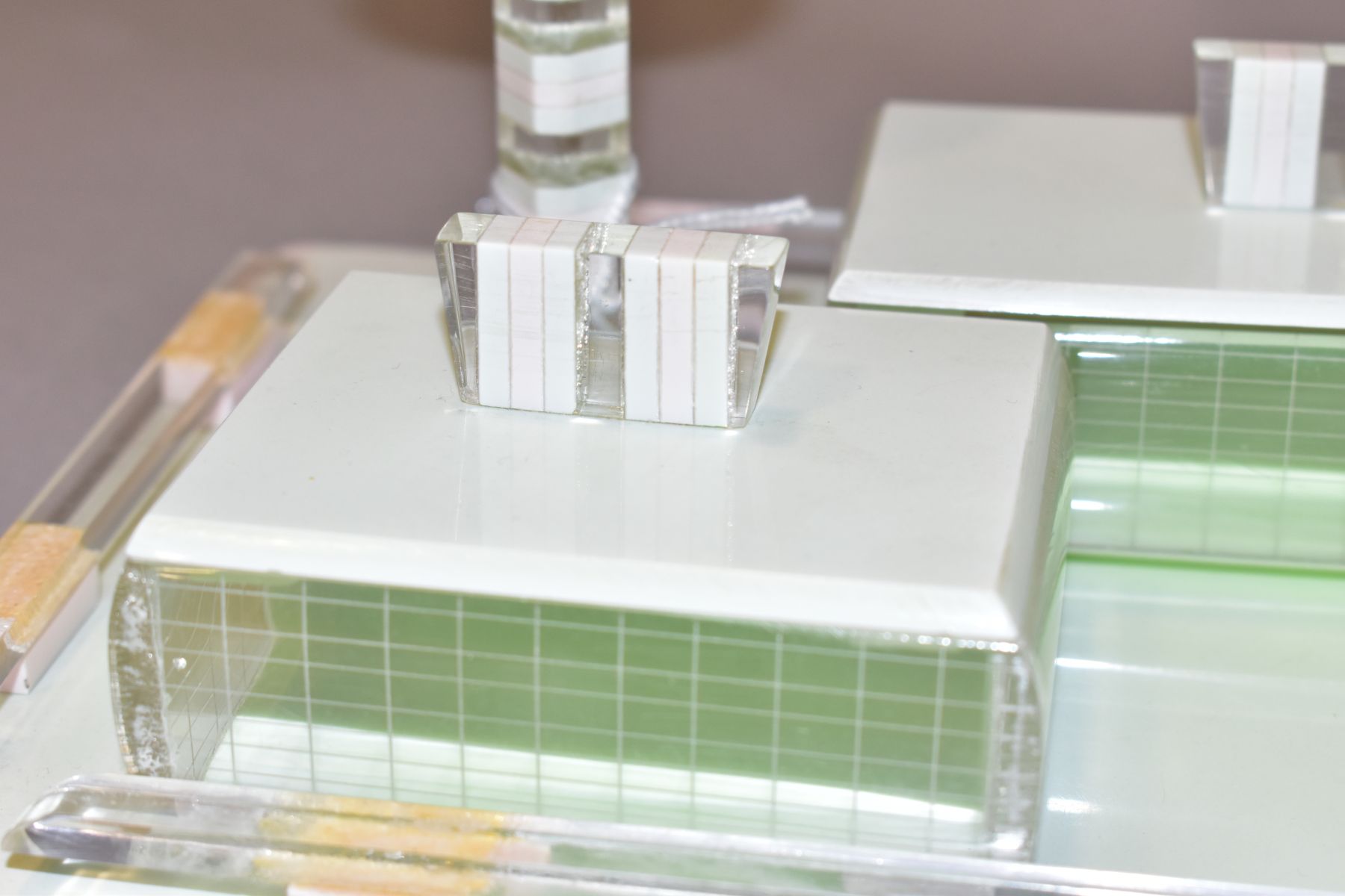 AN ART DECO PINK, GREEN AND CLEAR PLASTIC DRESSING TABLE SET, comprising rectangular tray, a pair of - Image 8 of 12