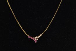 A RUBY AND DIAMOND COLLAR NECKLACE, a yellow metal flat link chain leading onto four graduating