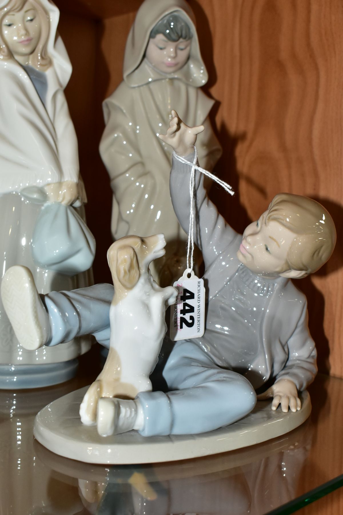 FOUR NAO PORCELAIN FIGURES OF CHILDREN, comprising boy lying down playing with a dog, possibly - Image 2 of 8