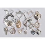AN ASSORTMENT OF WHITE METAL JEWELLERY, to include thirteen pendants, a ring with chain fastening,