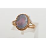 A 9CT GOLD OPAL RING, of an oval design, set with an opal cabochon, displaying blue and red play