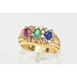 AN 18CT GOLD MUTLI GEM SET RING, designed with an oval cut ruby, emerald and blue sapphire, each