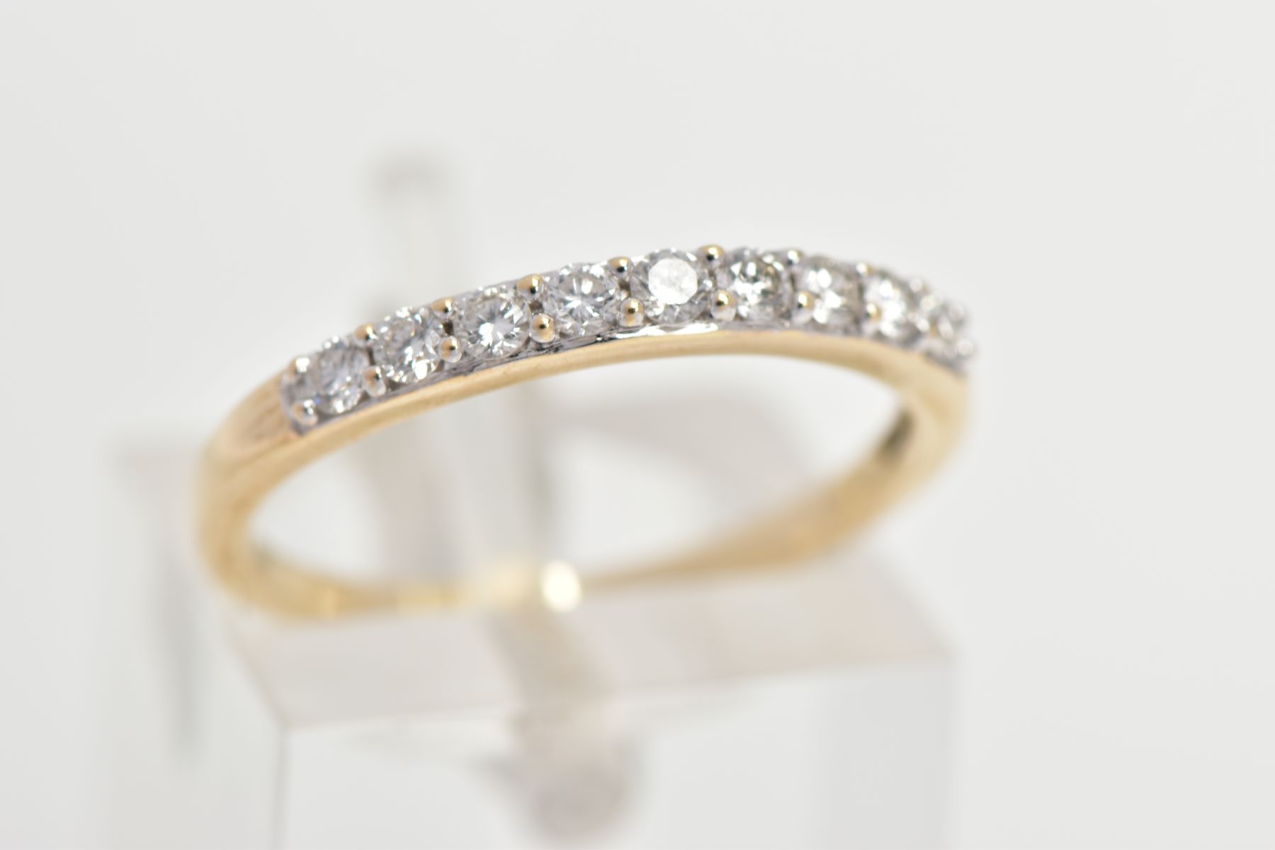 A 9CT GOLD DIAMOND HALF ETERNITY RING, designed with a row of nine claw set round brilliant cut - Image 4 of 4