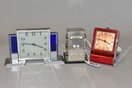 A VINTAGE JAEGER TWO DAY TRAVEL ALARM CLOCK, chromed and red painted case, square copper dial with