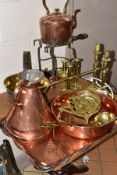 A GROUP OF COPPER AND BRASSWARES, to include a large copper tray with foliate border and wavy