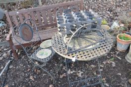 A METAL FOLDING GARDEN TABLE 70cm in diameter with a lattice top, two matching folding chairs