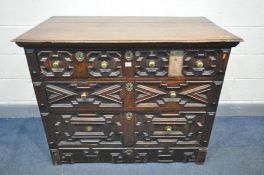 A 17TH CENTURY OAK CHEST OF TWO SHORT OVER TWO LONG DRAWERS, with geometric panelling, width 117cm x