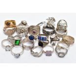 AN ASSORTEMENT OF WHITE METAL RINGS, to include a large silver signet ring set with colourless