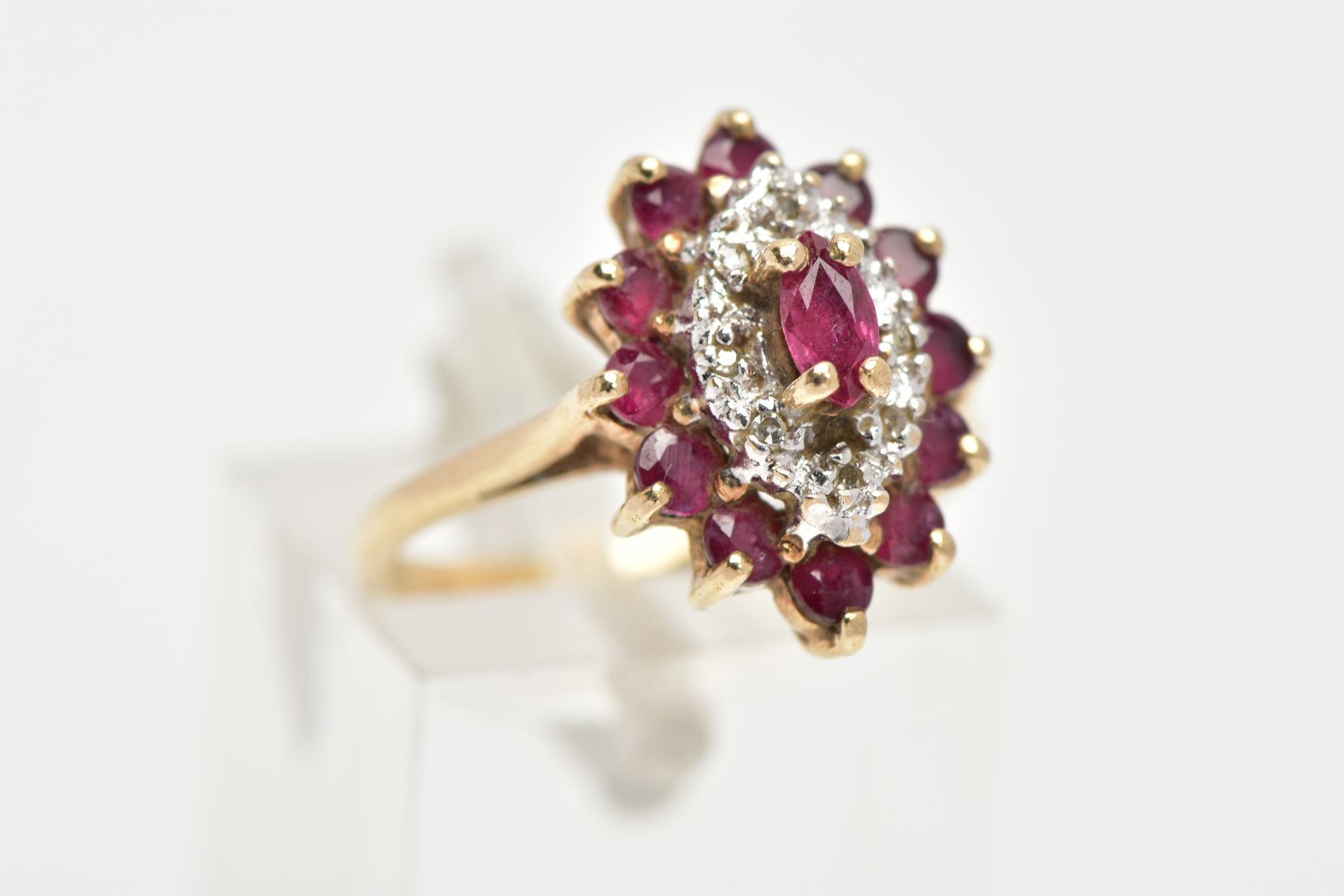 A 9CT GOLD RUBY AND DIAMOND CLUSTER RING, slightly raised cluster of a navette form, set with a - Image 4 of 4