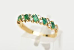 AN 18CT GOLD EMERALD AND DIAMOND HALF ETERNITY RING, designed with a row of rectangular cut emeralds