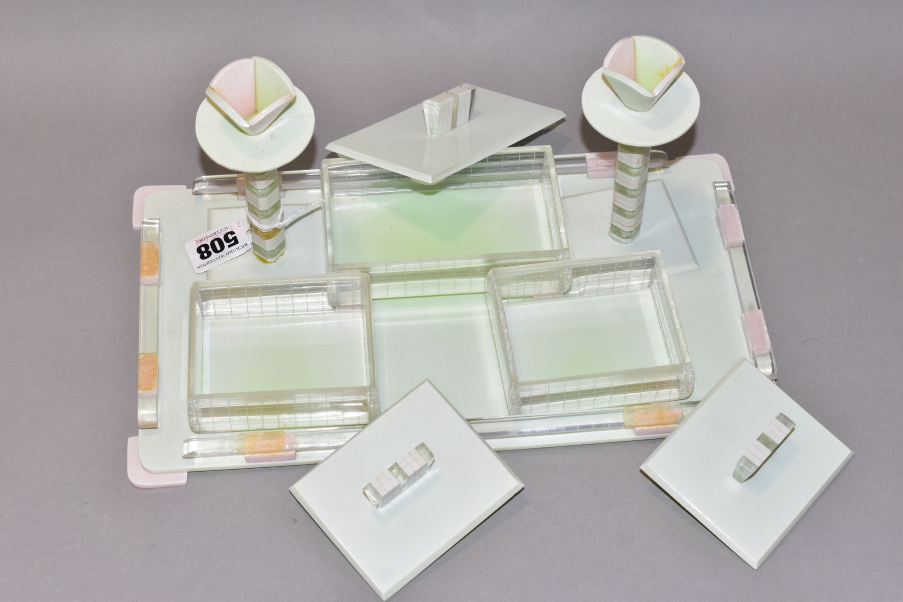 AN ART DECO PINK, GREEN AND CLEAR PLASTIC DRESSING TABLE SET, comprising rectangular tray, a pair of - Image 2 of 12