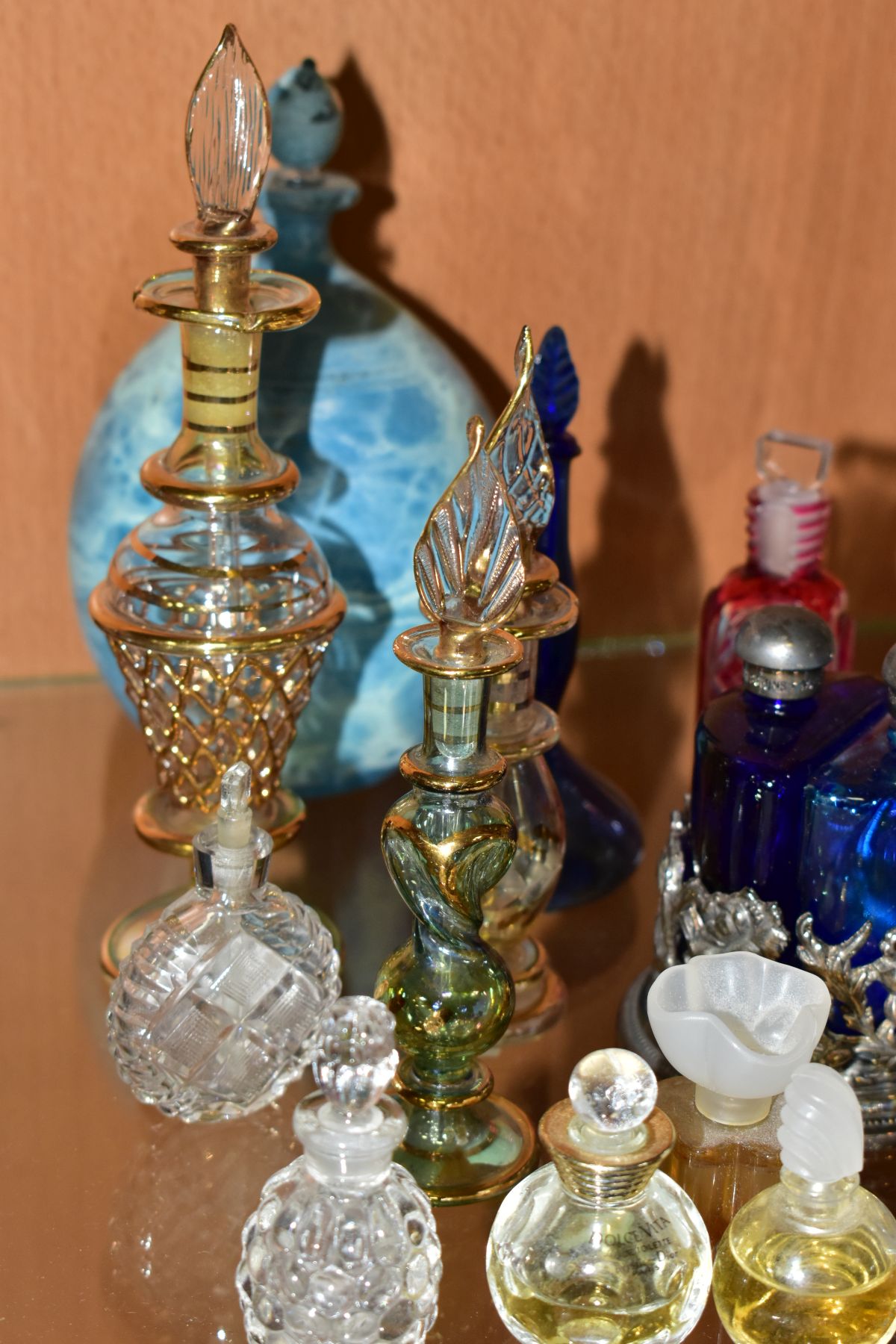 A COLLECTION OF 19TH AND 20TH CENTURY PERFUME BOTTLES , SPARE STOPPERS AND A FUNNEL, mostly glass, - Image 5 of 16
