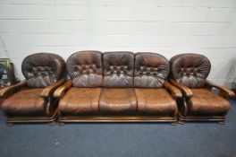 A BROWN LEATHER AND OAK FRAMED THREE PIECE SUITE, comprising a three seater sofa, and a pair of