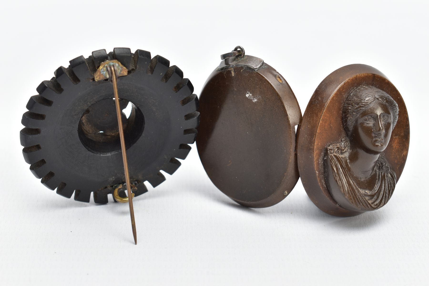 A JET BROOCH AND A VULCANITE PENDANT, the jet brooch of a circular form, decorated with carved - Image 4 of 6