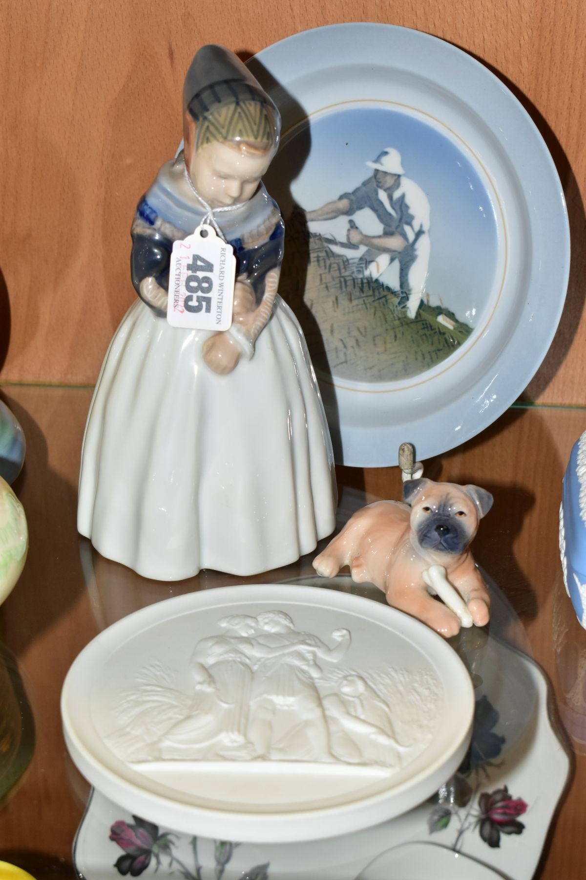 FOUR PIECES OF ROYAL COPENHAGEN PORCELAIN, comprising Amager Girl, no 1251 by Lotte Bentner, a puppy