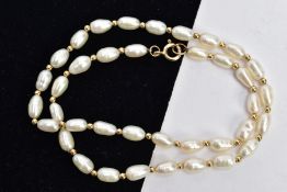 A CULTURED FRESHWATER PEARL NECKLACE, thirty-eight baroque fresh water pearls interspaced between