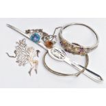 A BAG OF ASSORTED ITEMS, to include a white metal hinged bangle, set with vary cut gemstones,