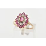 A 9CT GOLD RUBY AND DIAMOND CLUSTER RING, slightly raised cluster of a navette shape, set with a